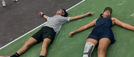 Rex Thais and Aline Morales celebrating their Open Doubles title in Cambodia