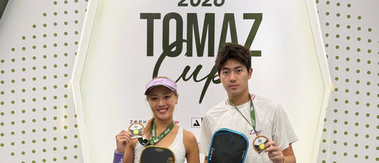 Agnes Fan and Li Zefeng on the podium at the 2026 Tomaz Cup.