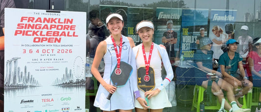 Agnes Fan and her women's doubles partner with silver medals