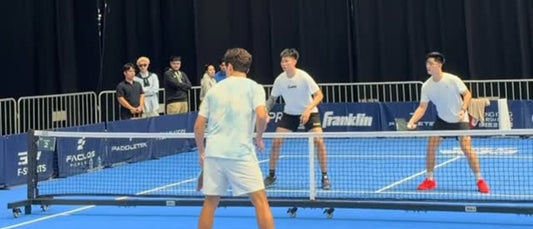 Jimmy Liong, partnering Loh Shi Sheng against China's top pair in their first match at Kai Tak.