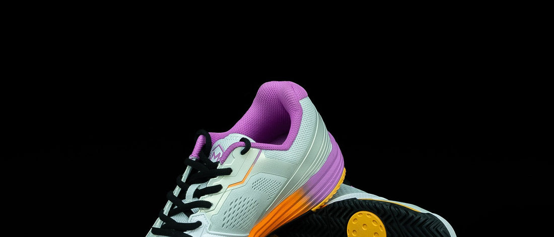A pair of Drop 1.0 Sunset shoes, sole up