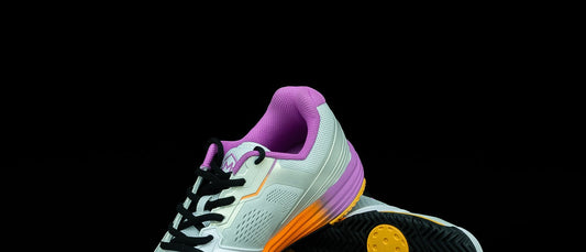 A pair of Drop 1.0 Sunset shoes, sole up