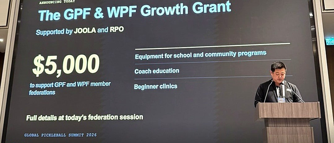 Richard Lee, JOOLA CEO and President, at the podium beside the Growth Grant slide at the Global Pickleball Summit 2026 in Hong Kong.
