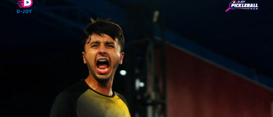 Harsh Mehta celebrates at D-Joy Pickleball Tour, holding a Luzz-branded paddle