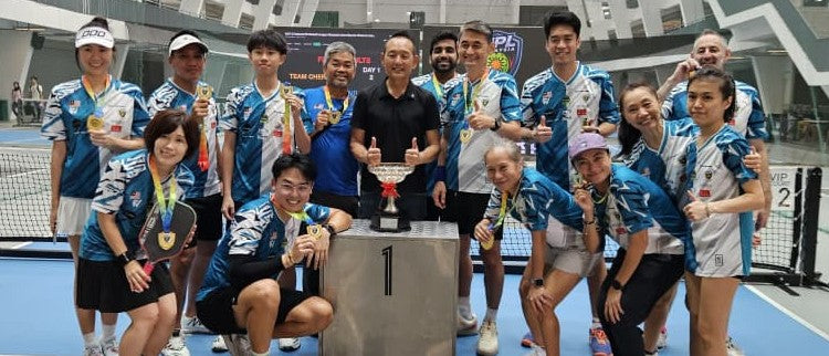 Team Kuala Lumpur players pose with a trophy after the second NPL pre-season fixture