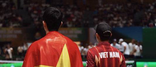 Team Vietnam players wrapped in the national flag after their World Cup final run